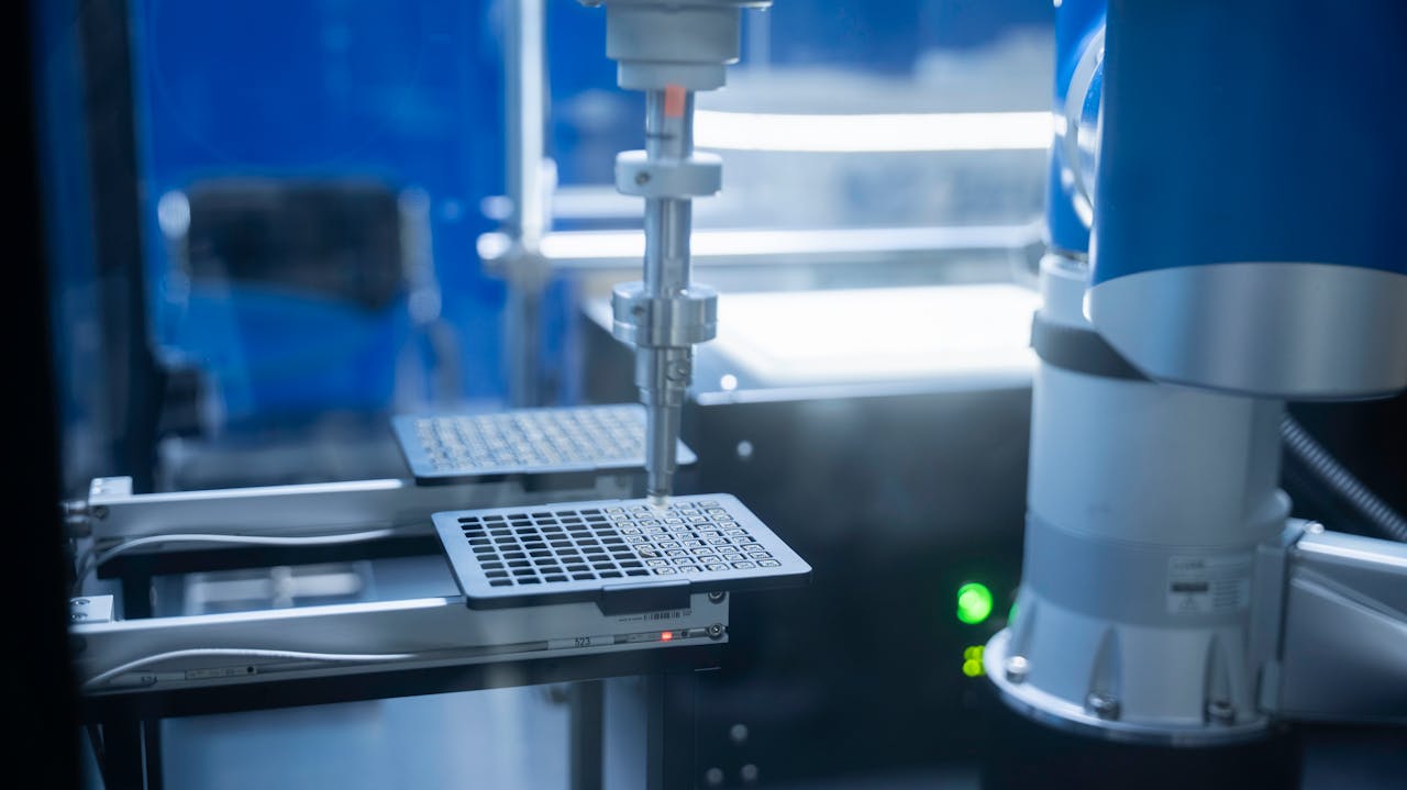 Services-02 Close-up of robotic arm automating lab processes with precision.