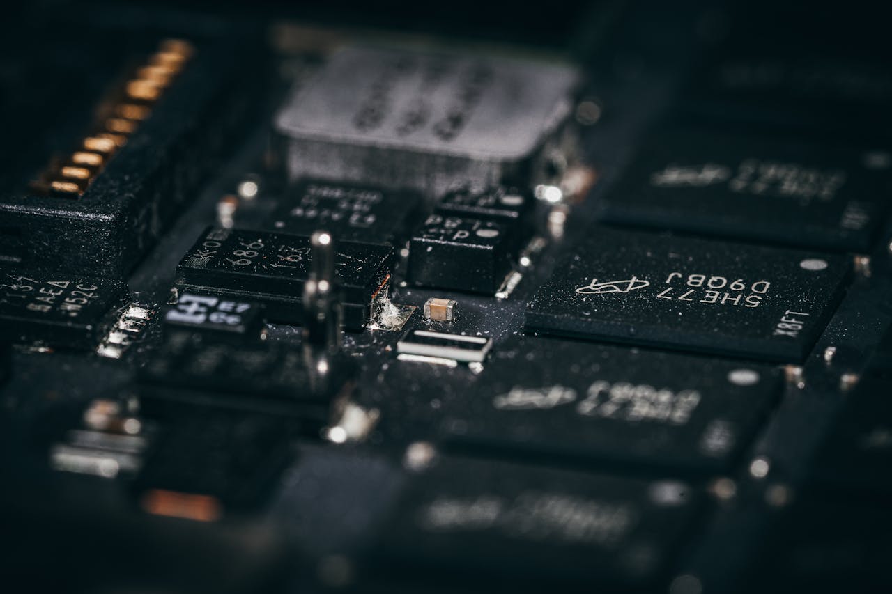 Services-01 Detailed macro shot of electronic circuit components showcasing intricate design and layout.